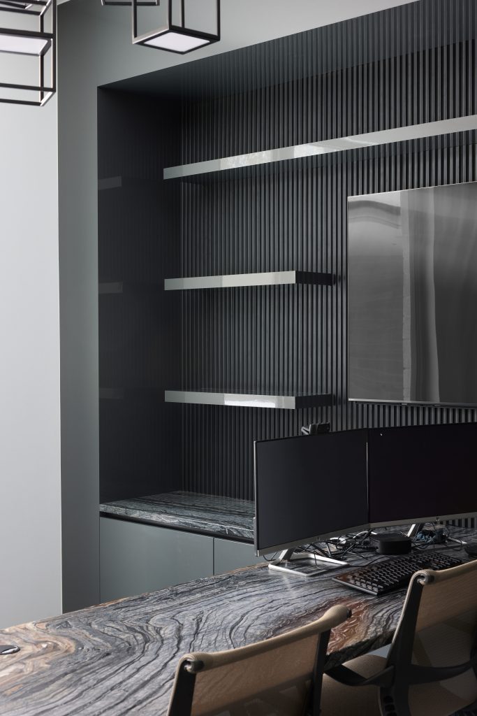 The Moonlight Study — a tonal, minimalist workspace with fluted matte wall paneling, floating Silver Wave quartzite desk, and seamless anthracite cabinetry.